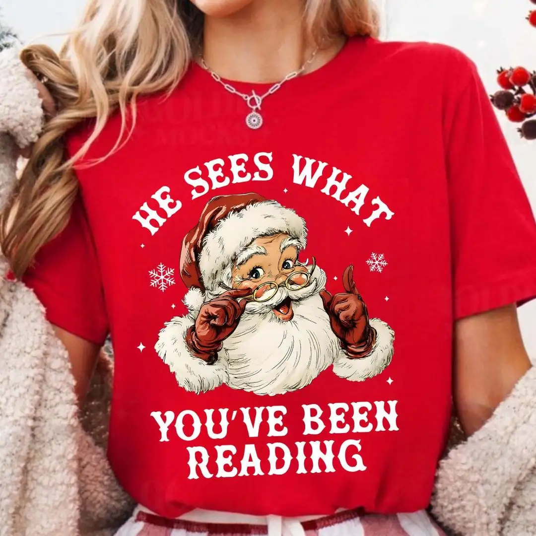 Santa Reading Shirt, He Sees What You’ve Been Reading Shirt, Christmas Book Shirt, Santa Bookworm Tee, Book Lovers Gift, Reading Holiday Top