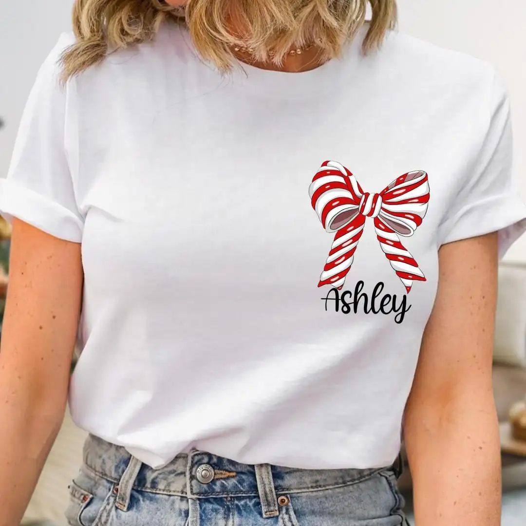 Personalized Women's Christmas Shirt, Kids Xmas Bow Shirt, Festive Gift Idea, Custom Name Christmas Shirt, Coquette Bow Holiday Tee