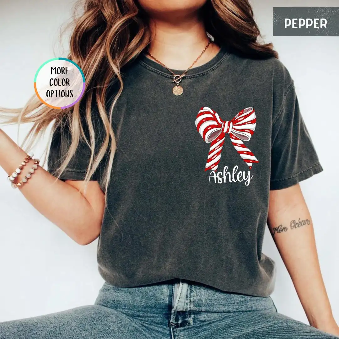 Comfort Colors Custom Name Christmas Shirt, Personalized Girly Christmas Tee, Coquette Bow Xmas Shirt For Women, Custom Holiday Gift Shirt